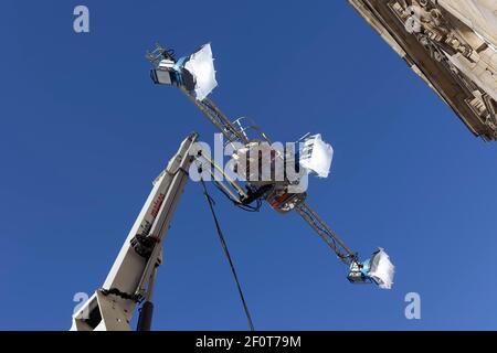 Three spotlights in front of a blue sky, mounted on a working stage, Filmlicht, Duesseldorf, North Rhine-Westphalia, Germany