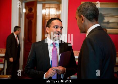 President Barack Obama talks with Gautam Raghavan in the Red Room of the White House June 13 2013. Stock Photo