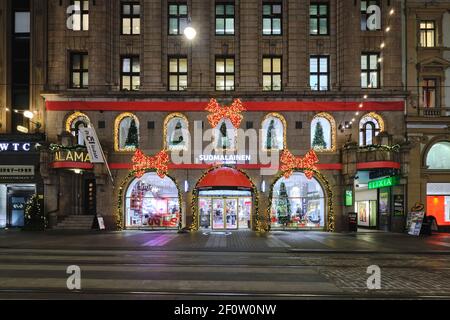Helsinki, Finland - December 14, 2020: The Christmas decoration on the facade of Suomalainen Bookstore on Aleksanterinkatu Street. Stock Photo