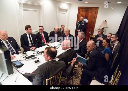 President Donald Trump receives a briefing Thursday April 6 2017 on a military strike on Syria from his National Security team including a video teleconference with U.S. Secretary of Defense Gen. James Mattis and Chairman of the Joint Chiefs of Staff Gen. Joseph F. Dunford in a secured location at Mar-a-Largo in Palm Beach Florida.  Editorâ€™s Note: Items in this image have been altered for security purposes.