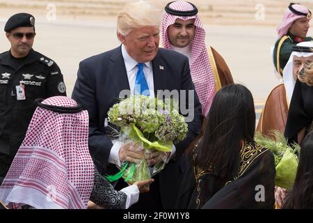 President Donald Trump and First Lady Melania Trump are welcomed with bouquets of flowers Saturday May 20 2017 on their arrival to King Khalid International Airport in Riyadh Saudi Arabia. (Official White House Photo by Andrea Hanks) Stock Photo