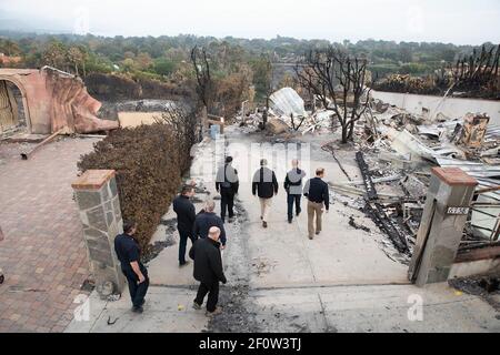 President Donald Trump joined by California Governor Jerry Brown and Governor-elect Gavin Newsom and FEMA Adminstrator Brock Long visits a neighborhood Saturday Nov. 17 2018 in Malibu Calif. devastated by the Woolsey fire. Stock Photo