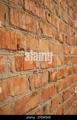 Old red brick wall background. Perspective view. Stock Photo