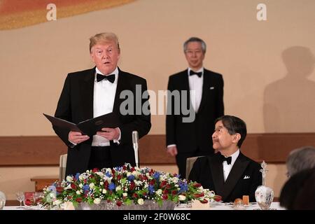 President Donald Trump delivers remarks as Emperor Naruhito of Japan listens during the state banquet at the Imperial Palace Monday May 27 2019 in Tokyo. Stock Photo