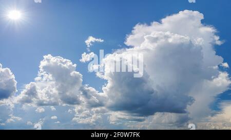 Dramatic white clouds on blue sky Stock Photo