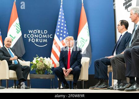 President Donald Trump joined by Treasury Secretary Steven Mnuchin and National Security Advisor Robert O'Brien meets with the President of the Republic of Iraq Barham Salih during the 50th Annual World Economic Forum meeting Wednesday Jan. 22 2020 at the Davos Congress Centre in Davos Switzerland. Stock Photo