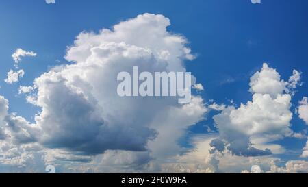 Dramatic white clouds on blue sky Stock Photo