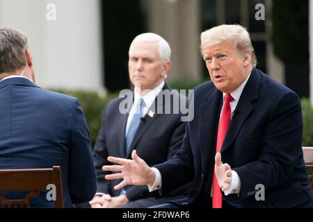 President Donald Trump participates in a virtual Fox News Town Hall Tuesday March 24 2020 in the Rose Garden of the White House. Stock Photo