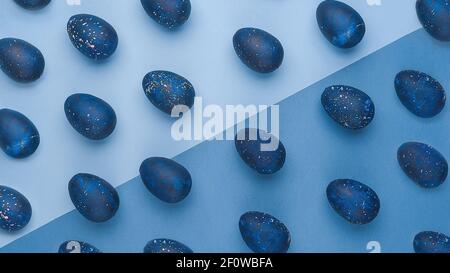 trendy Easter egg pattern of color of the year-classic blue with gradient effect. . Top view Stock Photo