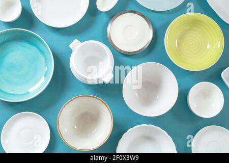 Ceramic dishes on blue background Stock Photo