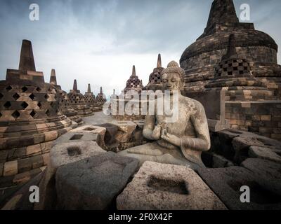 Ancient ruins of Borobudur, a 9th-century Mahayana Buddhist temple in Magelang Regency near Yogyakarta in Central Java, Indonesia. Stock Photo