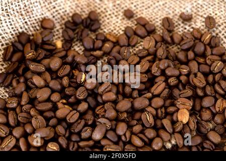 Coffee beans on burlap background Stock Photo