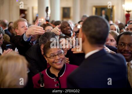 President Barack Obama greets guests in the Grand Foyer of the White House during a holiday reception Dec. 14 2009. Stock Photo