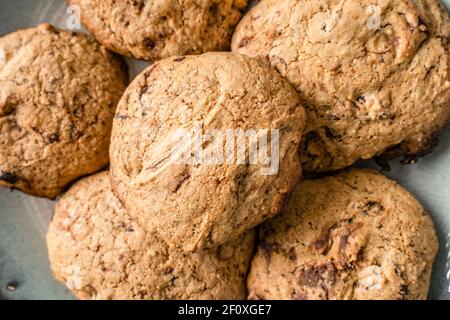 Close up on crunchy oatmeal chip cookies fresh baked biscuits with chocolate Stock Photo
