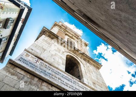 Bell tower of the religious complex of the church of the Santa Chiara in the historical center of Naples, Italy Stock Photo