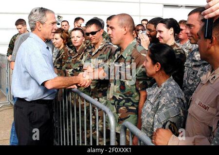 16 September 2006 - Ellington Field, Texas - President George W. Bush shakes hands with military members Sept. 16 at Ellington Field, Texas, before assessing the damage from Hurricane Ike from the Marine 1 helicopter around the Gulf Coast. Active duty, Reserve and Guard servicemembers are assisting with the relief effort after the storm ravaged the region. Photo Credit: Marcus Falleaf/DOD/Sipa Press/0809191541