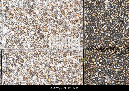 Pebble stone in outdoor tiles with geometric shapes. Close-up. Copy space Stock Photo