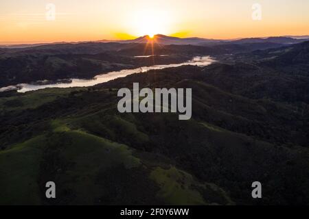 A brilliant sunrise greets the hills of the East Bay, not far from San Francisco Bay in California. Stock Photo