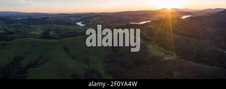 A brilliant sunrise greets the hills of the East Bay, not far from San Francisco Bay in California. Stock Photo