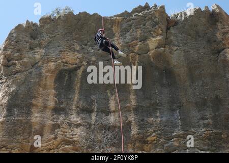 Hebron. 5th Mar, 2021. A Palestinian woman rappels down a steep cliff in Wadi al-Qaf Nature Reserve in the West Bank city of Hebron, March 5, 2021. Contrary to what is common in their society, a group of young Palestinian women take part in rappelling from the dangerous cliffs in the West Bank. Credit: Mamoun Wazwaz/Xinhua/Alamy Live News Stock Photo