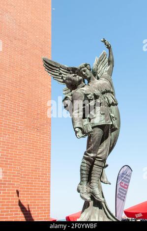 Vancouver BC, Canada - July 19, 2010: Angel of Victory by sculptor Coeur de Lion MacCarthy outside Waterfront Station depicts a young fallen soldier b Stock Photo