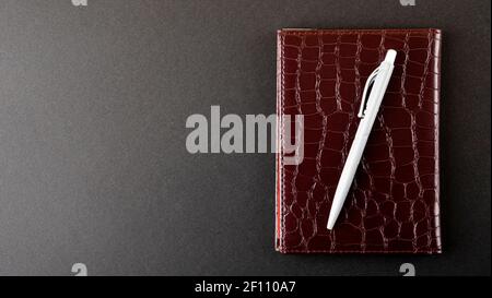 Notebook and ballpoint pen isolated on white background Stock Photo
