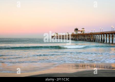 Coastal scene at dawn with a view of the Oceanside Pier. Oceanside, California, USA. Stock Photo