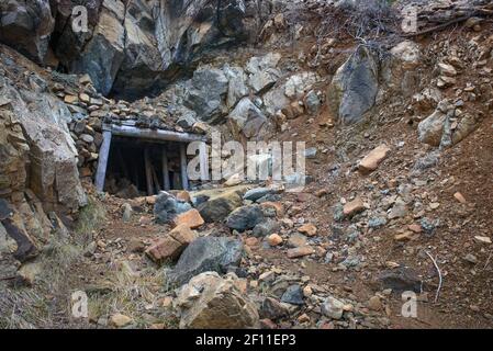 Entrance to old mine in mountains. Abandoned Hadjipavlou chromite mine in Troodos, Cyprus Stock Photo