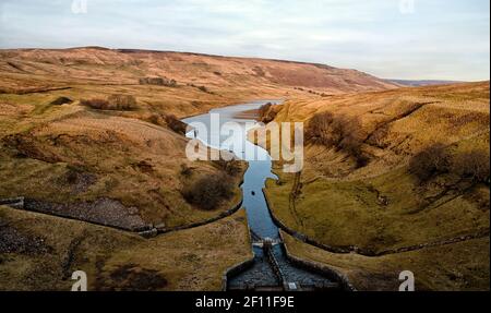 Looking down from the top of Angram reservoir dam to the spillway that feeds into Scar house reservoir, and supply Bradford West Yorkshire with water. Stock Photo