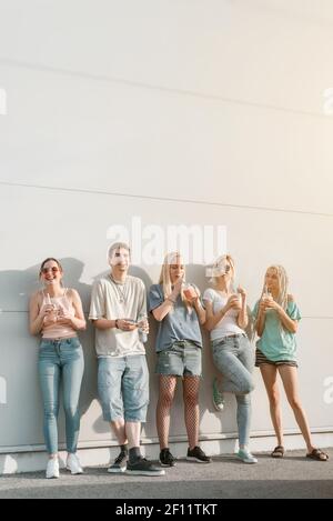 Group of young people, friends hanging together and laughing Stock Photo
