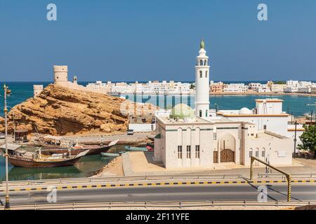 Middle East, Arabian Peninsula, Oman, Al Batinah South, Sur. Small mosque on the harbor in Sur, Oman. Stock Photo