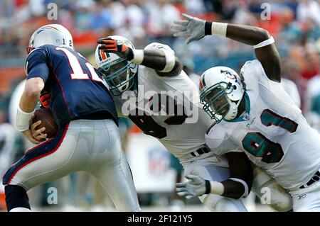 Miami Dolphins defensive end Kevin Carter, 93 celebrates after the