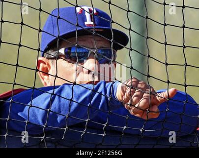 Texas Rangers hitting coach Rudy Jaramillo tips his hat to the