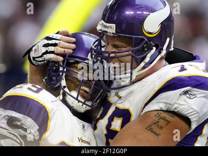 Minnesota Vikings' Matt Birk (78) and Steve Hutchinson chat during the  first day of football training camp at Minnesota State University, Mankato,  in Mankato, Minn., Friday, July 27, 2007. (AP Photo/Nati Harnik