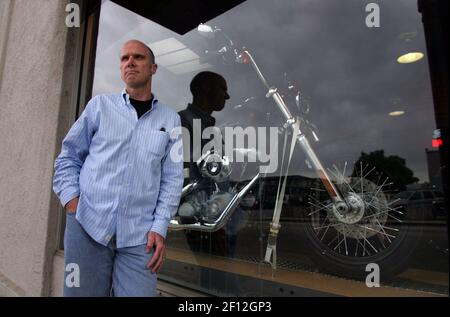 Mike James stands outside Santa Cruz Harley Davidson in Santa Cruz