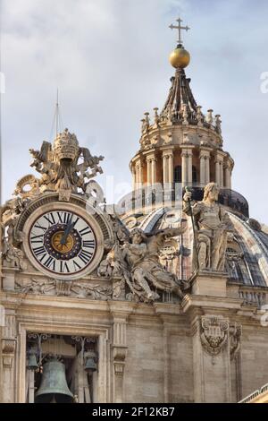 Clock on facade of Saint Peter basilica. Rome, Italy Stock Photo