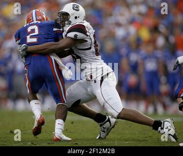 Gator running back Jeffery Demps (2) is brought down by Tennessee defenders  Jazen Jackson (L) and Eric Berry (R) in the first half of the NCAA football  game between the Tenessee Volunteers