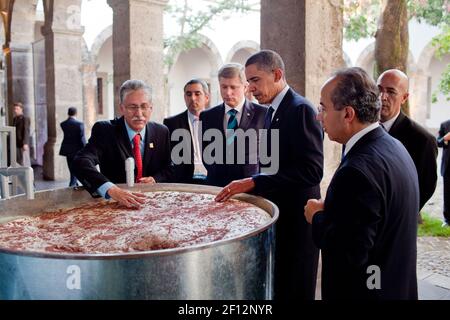 President Barack Obama, Stephen Harper, left, President Felipe Calderon, right, are shown a display on the making of tequila at the Cabanas Cultural Center in Guadalajara, Mexico, August 10, 2009 Stock Photo