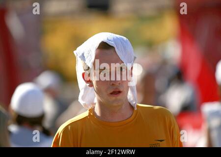 Tim Stawicki, of Chicago, walks away from the finish line with a cold and wet towel on his head during the 31st Chicago Marathon in Chicago, Illinois on Sunday, October 12, 2008. (Photo by JosÃ© M. Osorio/Chicago Tribune/MCT/Sipa USA)