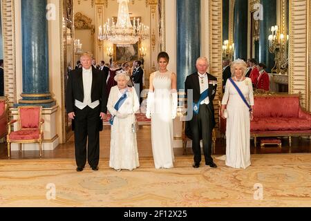President Donald Trump and First Lady Melania Trump pose for a photo with Britain's Queen Elizabeth II the Prince of Wales and the Duchess of Cornwall Monday June 3 2019 prior to attending a state banquet at Buckingham Palace in London. Stock Photo