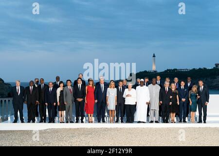President Donald Trump and First Lady Melania Trump participate in a family photo with G7 leaders extended partners and their spouses during the G7 Extended Partners Program Sunday Aug. 25 2019 at the Hotel du Palais in Biarritz France. (Official White House Photo by Andrea Hanks) Stock Photo
