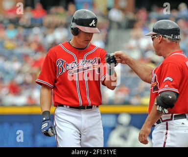 Atlanta Braves coach Glenn Hubbard, left, and infielder Kelly