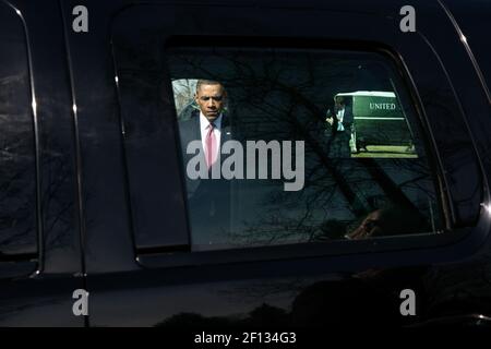President Barack Obama walks from Marine One to the waiting motorcade after arriving at the Walter Reed National Military Medical Center landing zone in Bethesda Md. March 5 2013. The President met with service members at Walter Reed National Military Medical Center awarding two Purple Hearts and taking part in one promotion ceremony during his visit. Stock Photo