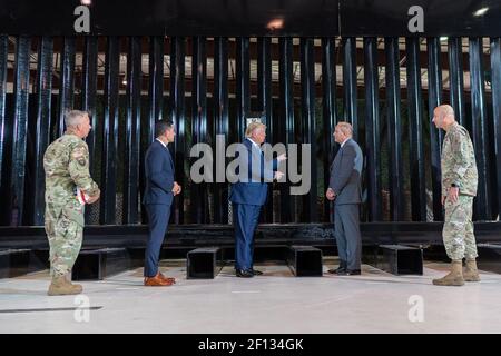 President Donald Trump is joined by Department of Homeland Security Acting Secretary Chad Wolf; U.S. Customs and Border Protection Acting Commissioner Mark Morgan; Chief of Engineers and Commanding General of the U.S. Army Corps of Engineers LTG Todd Semonite and MG Scott Spellmon Special Assistant to Commanding General LTG Semonite as President Trump receives an update on border wall construction operations Tuesday Aug. 18 2020 in the Joe Foss Hanger in Yuma Ariz. Stock Photo