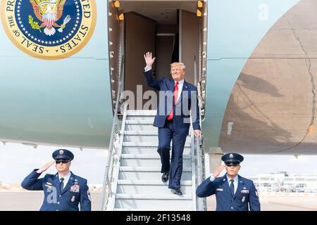 President Donald Trump disembarks Air Force One at Austin-Bergstrom International Airport in Austin Texas Wednesday Nov. 20 2019 where he was greeted by Texas Lt. Gov. Dan Patrick and Texas Attorney General Ken Paxton. Stock Photo