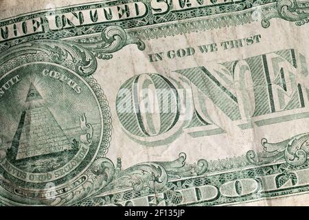Closeup of the back side of an old wrinkled dirty worn US dollar bill. Stock Photo