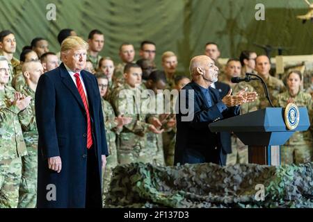 President Donald Trump listens as Afghan President Ashraf Ghani speaks to US military during a surprise Thanksgiving visit Thursday November 28 2019 at Bagram Airfield Afghanistan Stock Photo