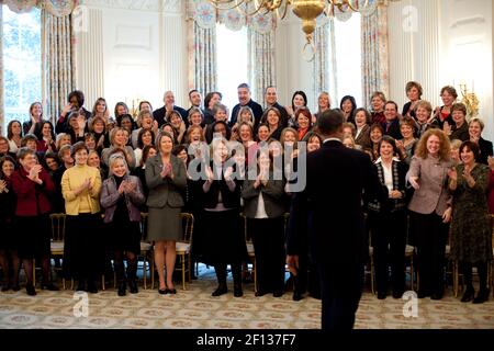 Teachers attending the Presidential Awards for Mathematics and Science applaud as President Barack Obama enters the State Dining Room of the White House Jan. 6 2010. Stock Photo