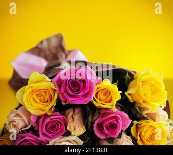 Bouquet of roses on yellow background Stock Photo