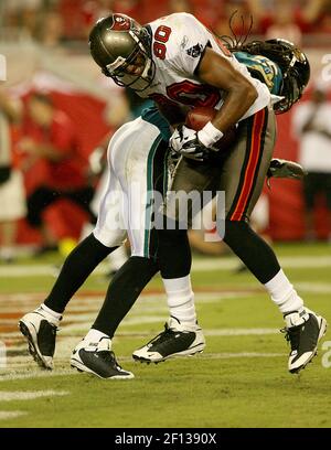 Tampa Bay Buccaneers receivers Michael Clayton (L) and John Gilmore watch  the scoreboard late in the fourth quarter against the Denver Broncos at  Invesco Field at Mile High in Denver on October